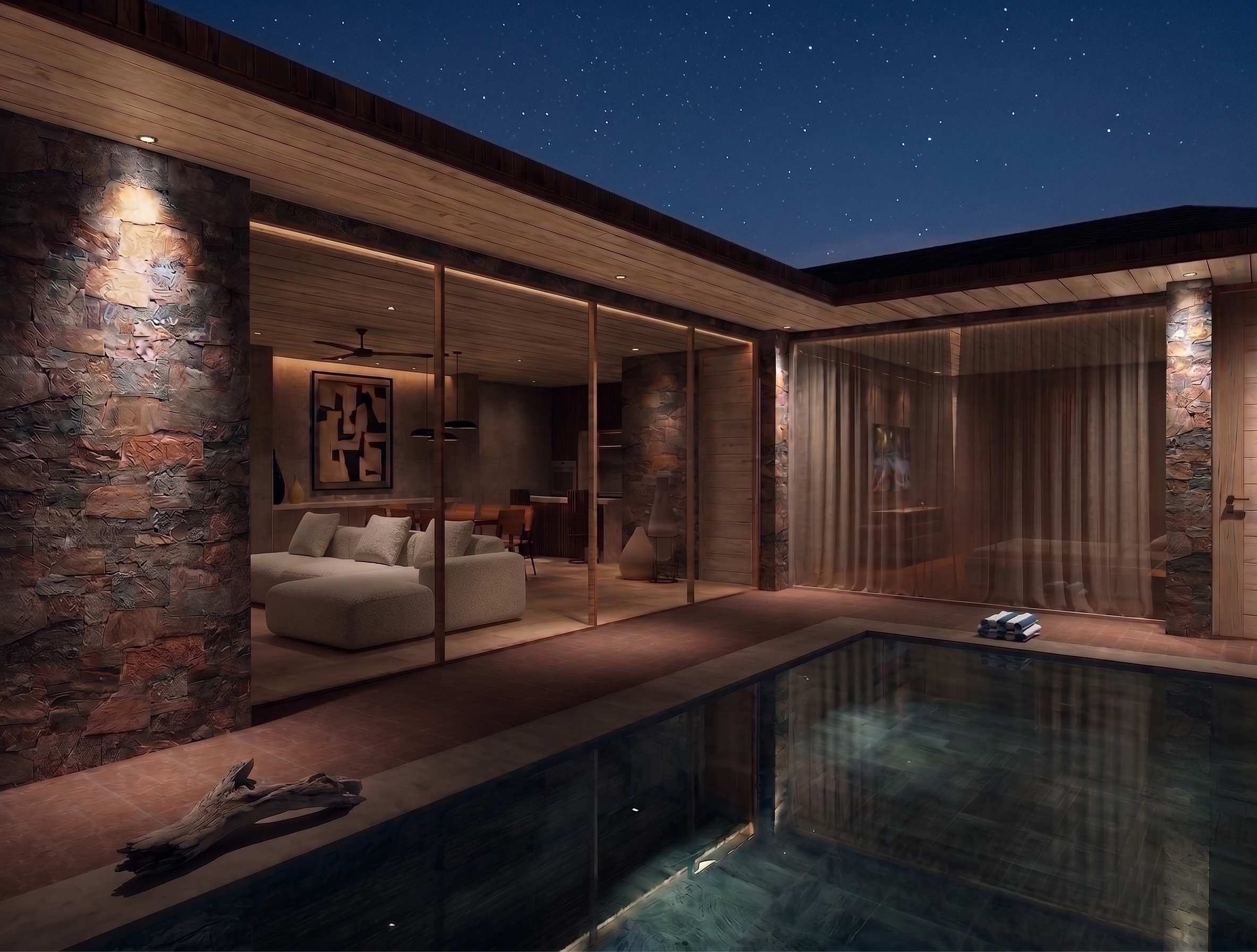 Piscina exterior de Villa Sucasas en Nusa Dua, Bali, con iluminación exterior que acentúa la materialidad